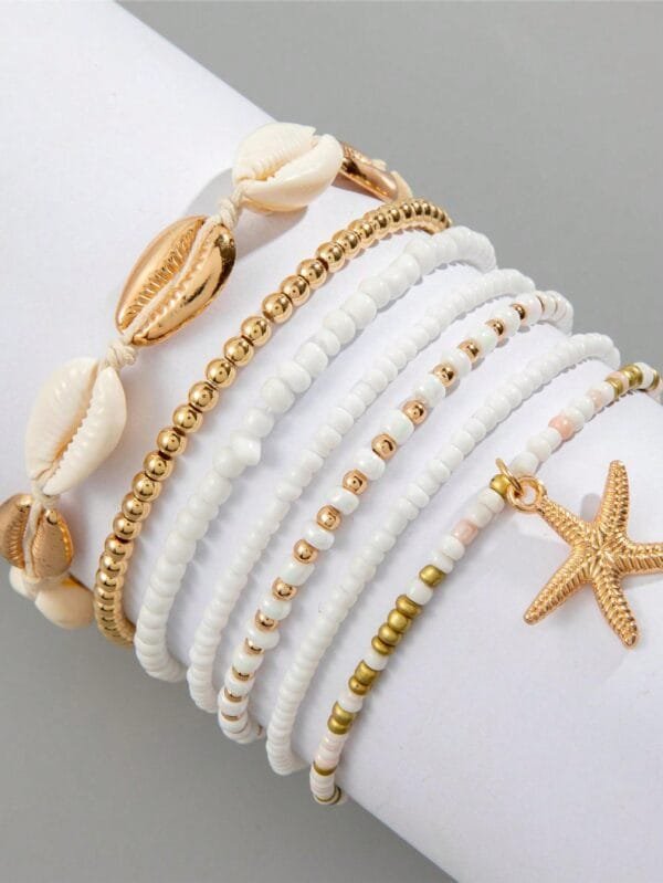 Conjunto de 7 pulseiras trançadas de arroz com conchas e estrelas do mar em liga de estilo europeu e americano para mulheres, perfeitas para a praia de verão.